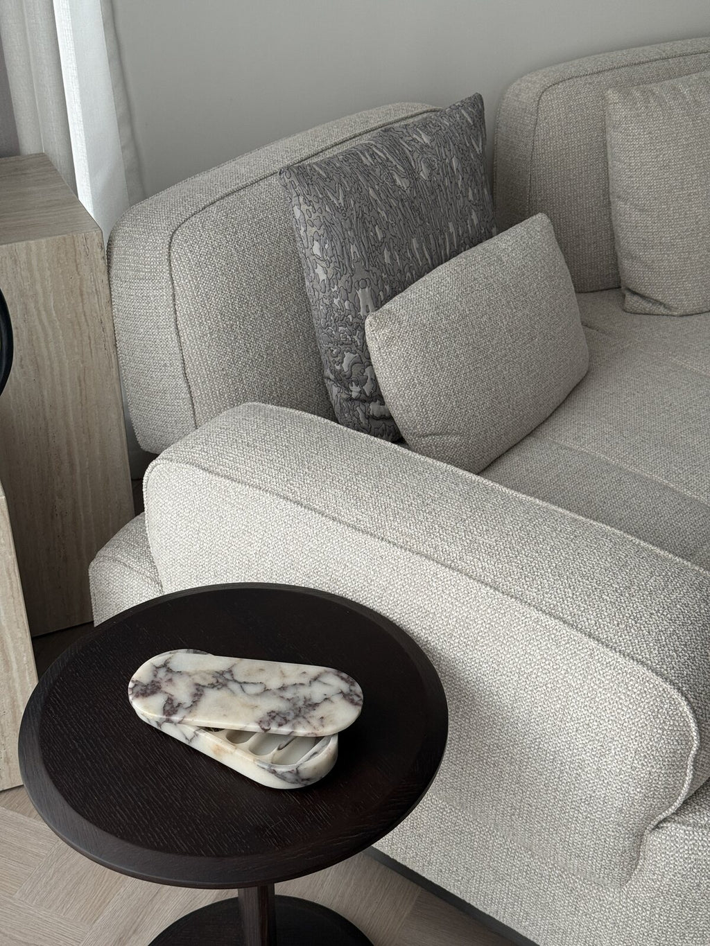 ourside marble pill box on a side table by an armchair